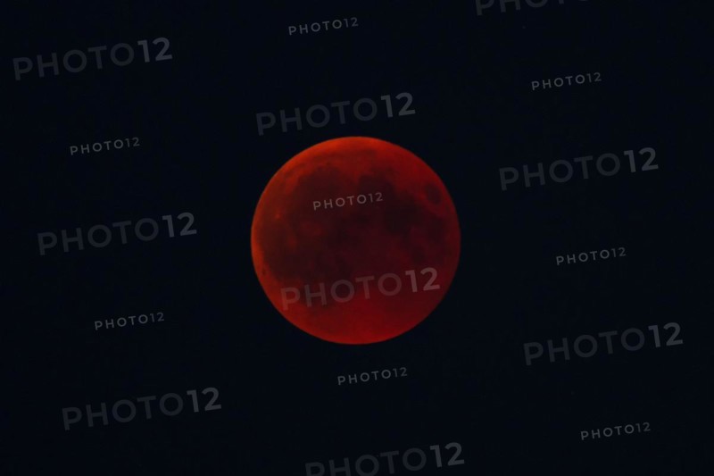 Intense red blood moon in the night sky, mystical atmosphere, Haan, North Rhine-Westphalia, Germany, Europe