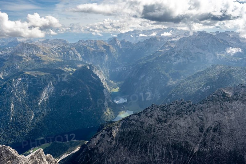 View from the summit of the Watzmann Mittelspitze, view of mountain panorama with Steinernes Meer, Koenigssee and Obersee, Watzmann crossing, Berchtesgaden National Park, Berchtesgaden Alps, Bavaria, Germany, Europe