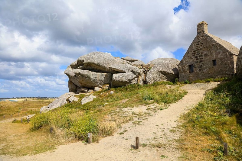Former village of Meneham on the Atlantic coast with partly thatched houses between granite rocks, now an open-air museum, Menez Ham, Kerlouan, Finistere Penn ar Bed department, Brittany Breizh region, France, Europe