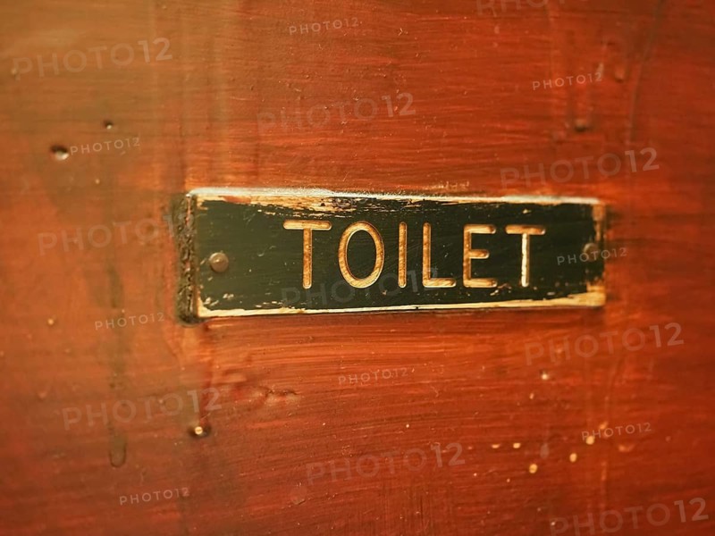 Toiled sign on door
