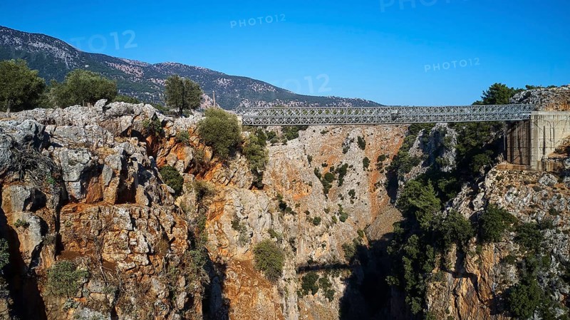 Metallic bridge over a deep gorge surrounded by a mountainous landscape, Aradena Gorge, Aradena, Sfakia, Crete, Greece, Europe