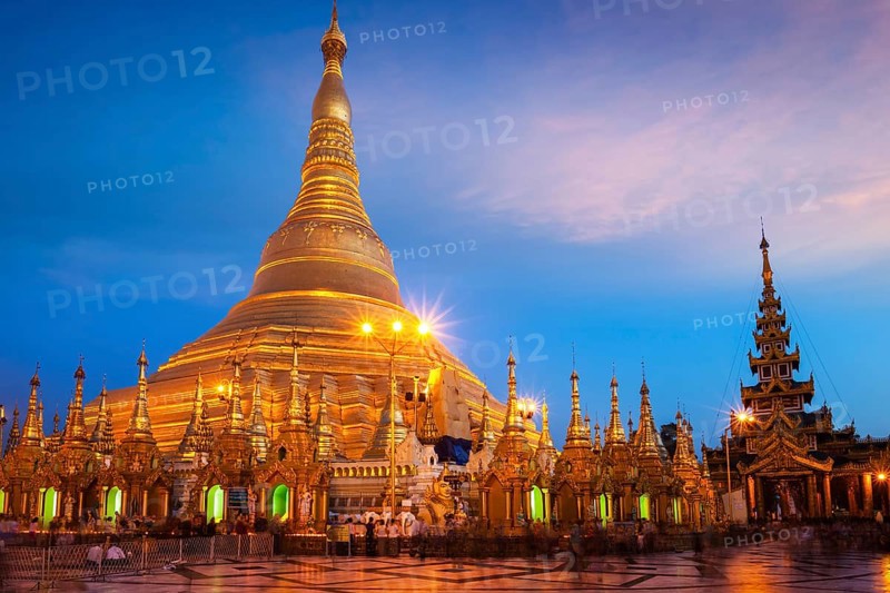 Myanmar famous sacred place and tourist attraction landmark, Shwedagon Paya pagoda illuminated in the evening. Yangon, Myanmar Burma