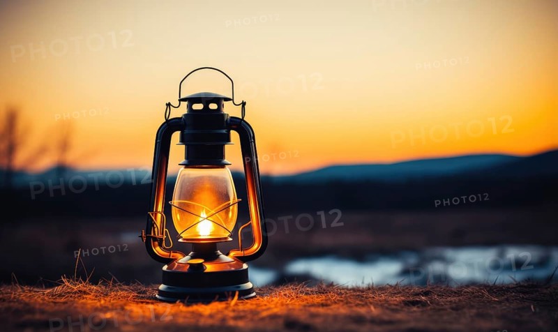 Kerosene lamp on the field at sunset. Camping concept AI generated