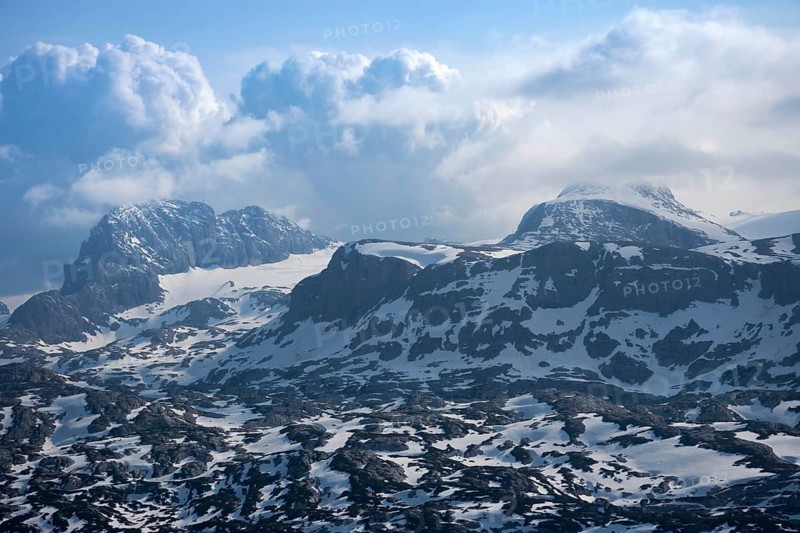 Amazing mountains panorama from 5 Fingers viewing platform in the shape of a hand with five fingers on Mount Krippenstein in the Dachstein Mountains of Upper Austria, Salzkammergut region, Austria, Europe