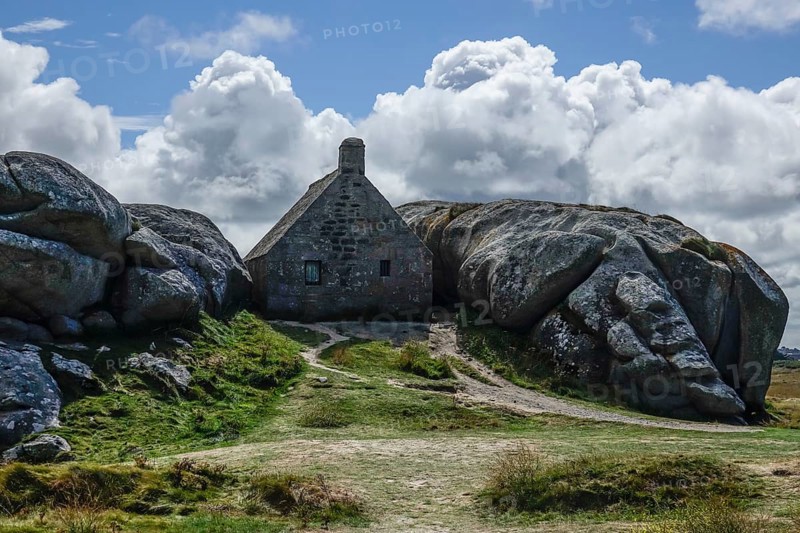 Former village of Meneham on the Atlantic coast with partly thatched houses between granite rocks, now an open-air museum, Menez Ham, Kerlouan, Finistere Penn ar Bed department, Brittany Breizh region, France, Europe