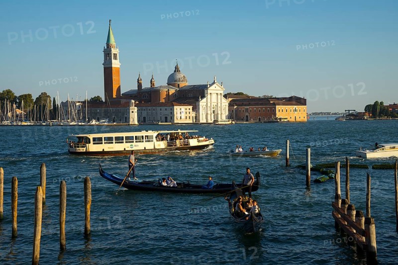 Gondolas on the promenade of the Riva degli Schiavon with a view of San Giorgia Maggiore, Venice, Veneto, Italy, Europe