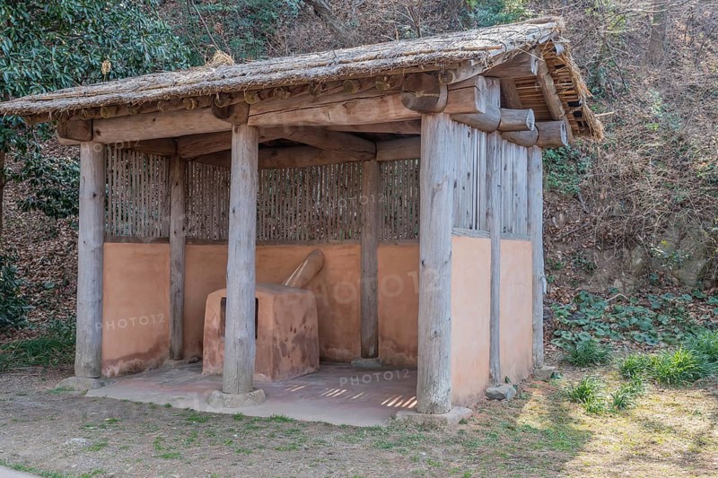 Thatched hut containing terracotta forging oven used at ship building site in Yeosu, South Korea, Asia