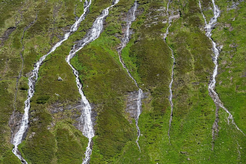 Waterfalls on a green mountainside, Berliner Hoehenweg, Zillertal Alps, Tyrol, Austria, Europe