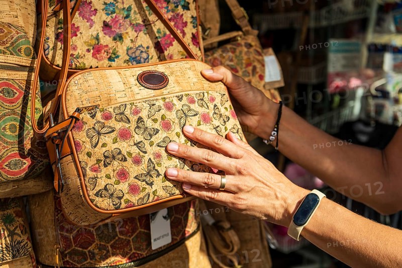 Woman buying a vintage cork bag, Coimbra
