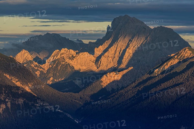 View over a valley to rugged mountains in the evening light, clouds, view from the Wank to the Karwendel mountains, Bavaria, Germany, Europe