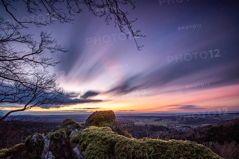 Landscape at the Grosser Zacken, Taunus volcanic region. A cloudy, sunny autumn day, meadows, hills, fields and forests with a view of the sunset. Hesse, Germany, Europe