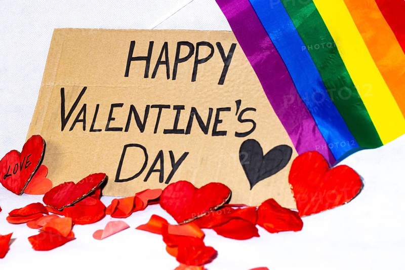 Cardboard sign Happy Valentine's Day lgbtq+ isolated. Text of Happy Valentine's Day written on a cardboard