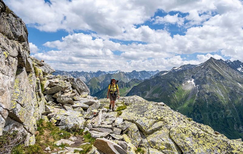 Mountaineer on hiking trail, Berliner Hoehenweg, mountain panorama with summit Grosser Ingent, Zillertal Alps, Tyrol, Austria, Europe