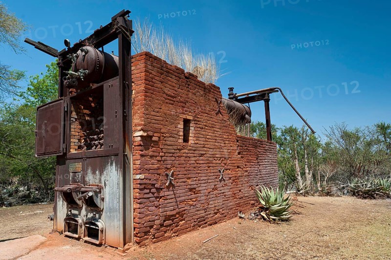 German decommissioned steam engine from 1904 at Lake Otjikoto, used as a pump to supply drinking water to the town of Tsumeb in Namibia