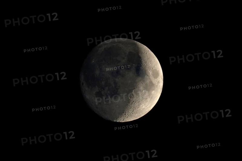 Waxing crescent moon seen with telescope