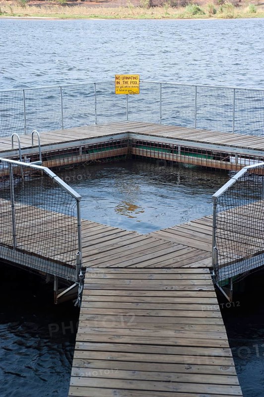 Pool as protection from crocodiles and hippos, swimming, bathing, danger, danger to life, pool, river in Ngepi camp, Divundu in Namibia