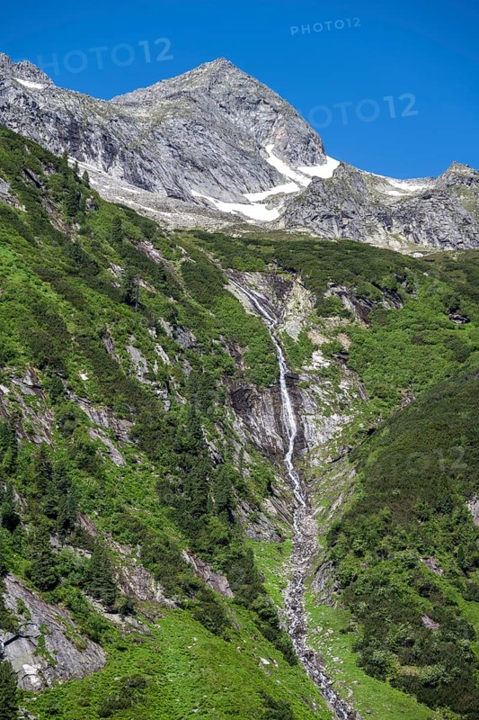 Waterfall of a mountain stream Kesselbach, rocky mountain peak, Berliner Hoehenweg, Zillertal Alps, Tyrol, Austria, Europe