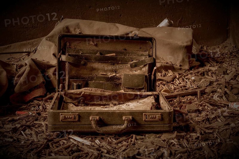 An abandoned, opened suitcase on a dirty floor in a gloomy environment, former railway junction Rethel, Lost Place, Flingern, Duesseldorf, North Rhine-Westphalia, Germany, Europe