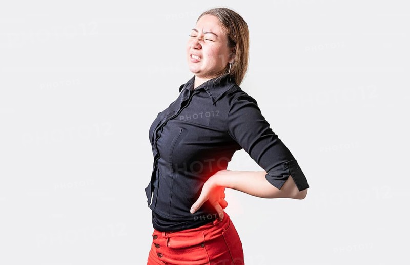 People with spine problems isolated. Suffering girl with back pain. Young woman with back pain. Lumbar problems concept