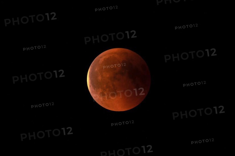 Blood red full moon at night, shining against a black sky, Haan, North Rhine-Westphalia, Germany, Europe