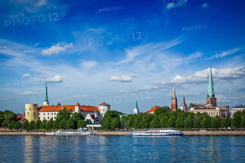 View of Riga over Daugava river: Riga Castle, St. James's Cathedral, St. Peter's Church. Riga, Latvia, Europe