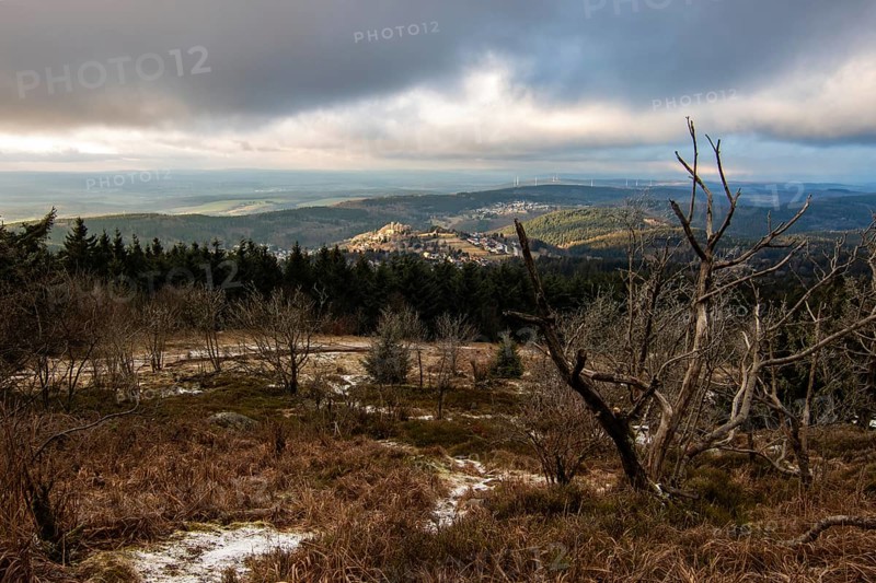 Landscape on the Grosser Feldberg, Taunus volcanic region. A cloudy, sunny winter day, meadows, hills, snow and forests with a view of the winter sunset. Hesse, Germany, Europe