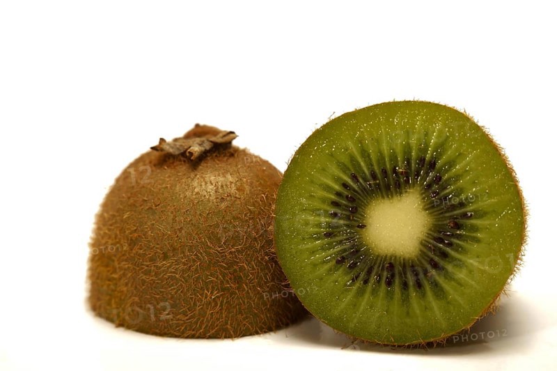 Close-up of a fresh kiwi cut in half isolated on white background and copy space