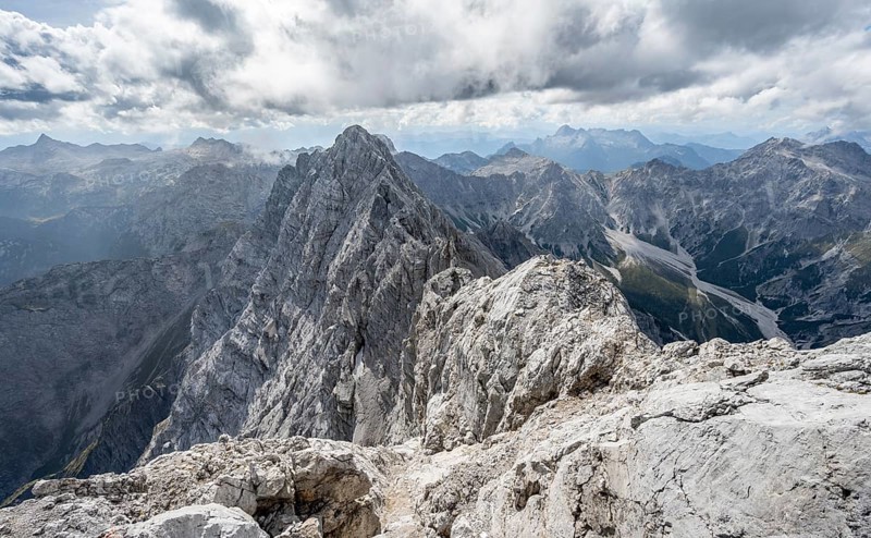 Rocky, narrow mountain ridge with Watzmann Suedspitze, view from Watzmann middle summit to mountain panorama with Wimbachgriestal and Steinernes Meer, Watzmann crossing, Berchtesgaden National Park, Berchtesgaden Alps, Bavaria, Germany, Europe