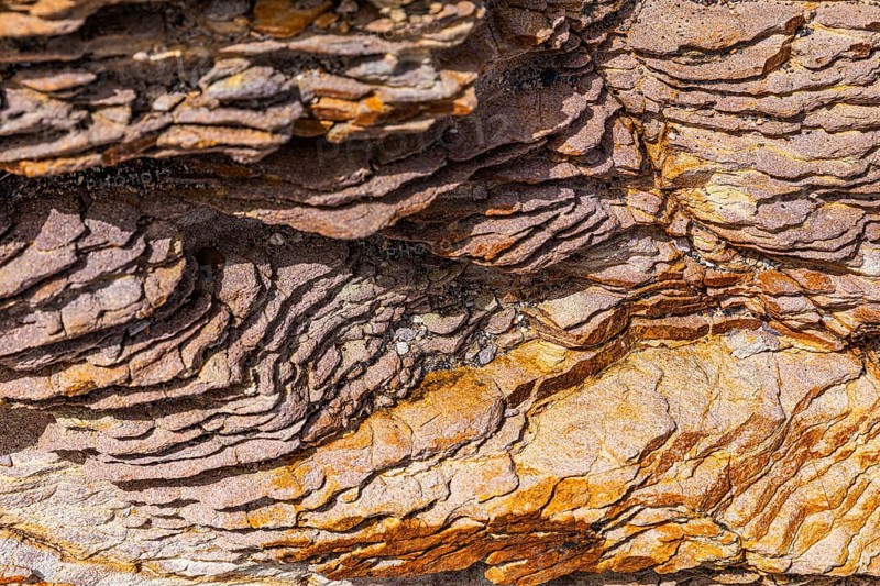 Coloured, ferruginous mineral sandstone on Topinetti beach, near Rio Marina, Elba, Tuscan Archipelago, Tuscany, Italy, Europe