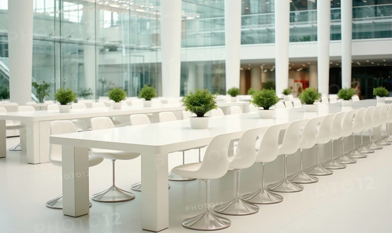 A minimalist, modern cafeteria with white tables and chairs, featuring small indoor plants AI generated