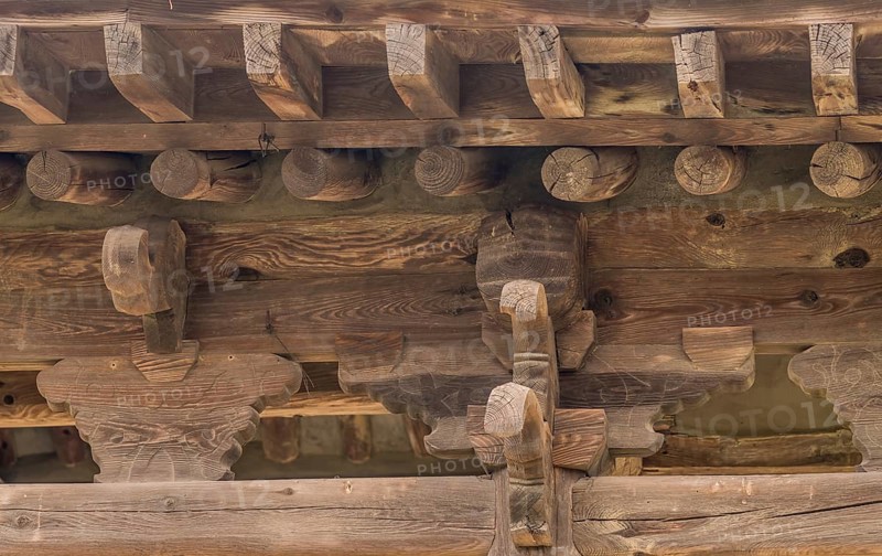 View of underside of roof of an old, unused oriental pavilion in a wooded area in South Korea