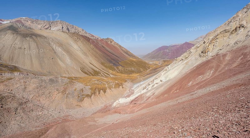 Mountain landscape of glacial moraines, mountains with red and yellow rocks, Traveller's Pass below Lenin Peak, Trans Alay Mountains, Pamir Mountains, Osh Province, Kyrgyzstan, Asia