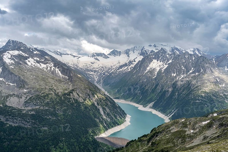 Mountain landscape, view of Schlegeis reservoir with dam wall, glaciated rocky mountain peaks Hoher Weisszint and Hochfeiler with Schlegeiskees glacier, Berliner Hoehenweg, Zillertal Alps, Tyrol, Austria, Europe