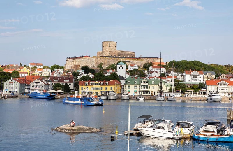 Ferry in the harbour of the archipelago island Marstrandsoe, behind the fortress Carlsten, Marstrand, province Vaestra Goetalands laen, Sweden, Europe
