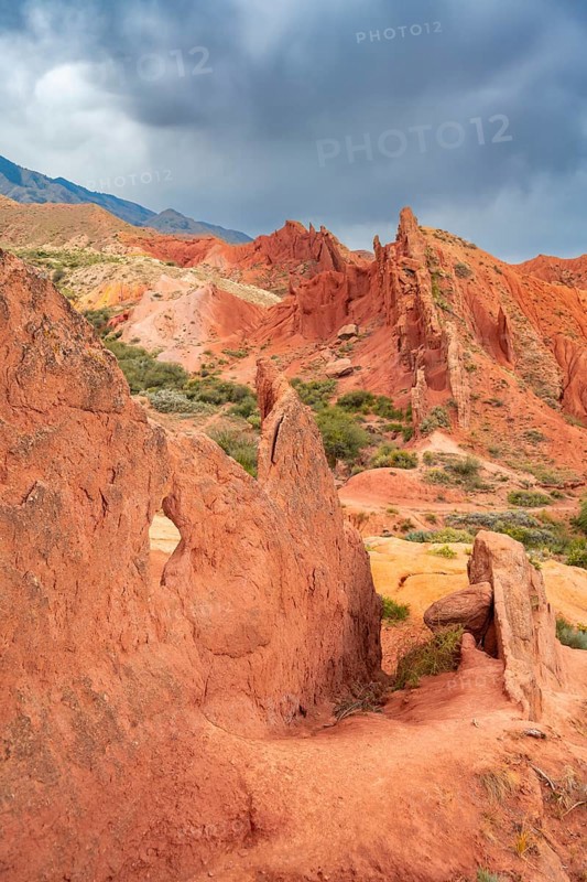 Eroded mountain landscape, sandstone cliffs, canyon with red and orange rock formations, Konorchek Canyon, Chuy, Kyrgyzstan, Asia