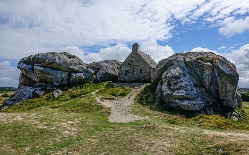 Former village of Meneham on the Atlantic coast with partly thatched houses between granite rocks, now an open-air museum, Menez Ham, Kerlouan, Finistere Penn ar Bed department, Brittany Breizh region, France, Europe