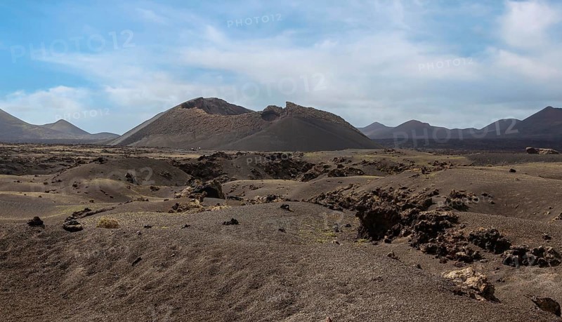Volcanic landscape with view of the Caldera de Los Cuervos, Timanfaya National Park, Lanzarote, Canary Islands, Spain, Europe
