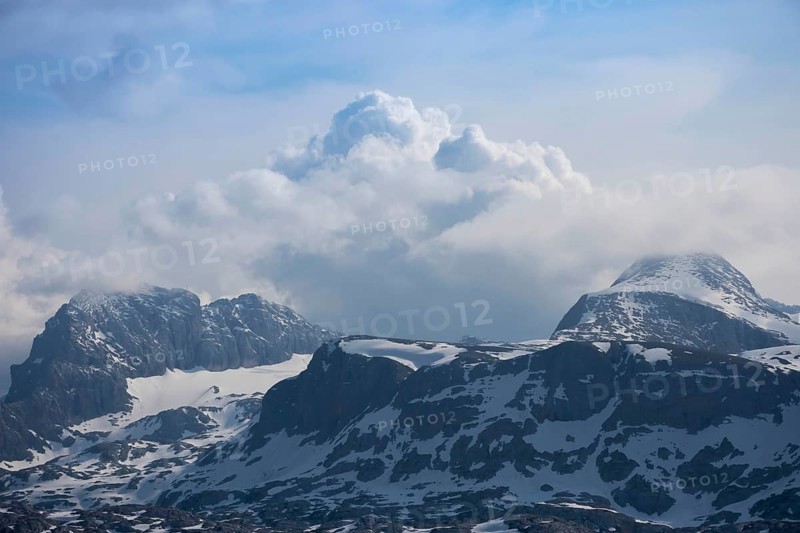 Amazing mountains panorama from 5 Fingers viewing platform in the shape of a hand with five fingers on Mount Krippenstein in the Dachstein Mountains of Upper Austria, Salzkammergut region, Austria, Europe