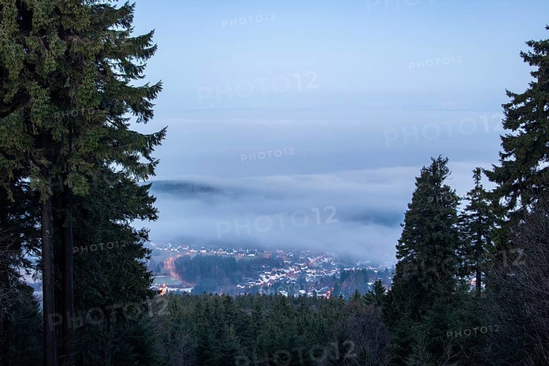 Landscape on the Grosser Feldberg, Taunus volcanic region. A cloudy, sunny winter day, meadows, hills, snow and forests with a view of the winter sunset. Hesse, Germany, Europe