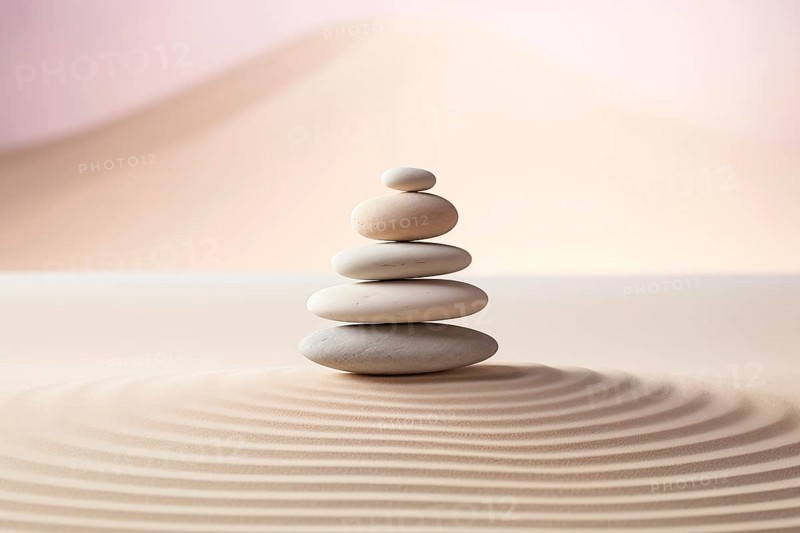 Zen stones stack on raked sand in a minimalist setting for balance and harmony. Balance, harmony, and peace of mind, wellness, meditation, and spirituality concept, AI generated