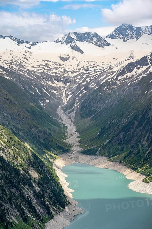 Mountain landscape, view of turquoise-blue lake Schlegeisspeicher, glaciated rocky mountain peaks Hoher Weisszint and Hochfeiler with glacier Schlegeiskees, Berliner Hoehenweg, Zillertal Alps, Tyrol, Austria, Europe