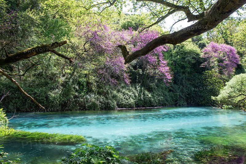Mountain lake Syri i Kalter, karst spring, underground terrain or so-called karst cave in carbonate rock formed by weathering, called the blue eye, Krongj, Albania, Europe