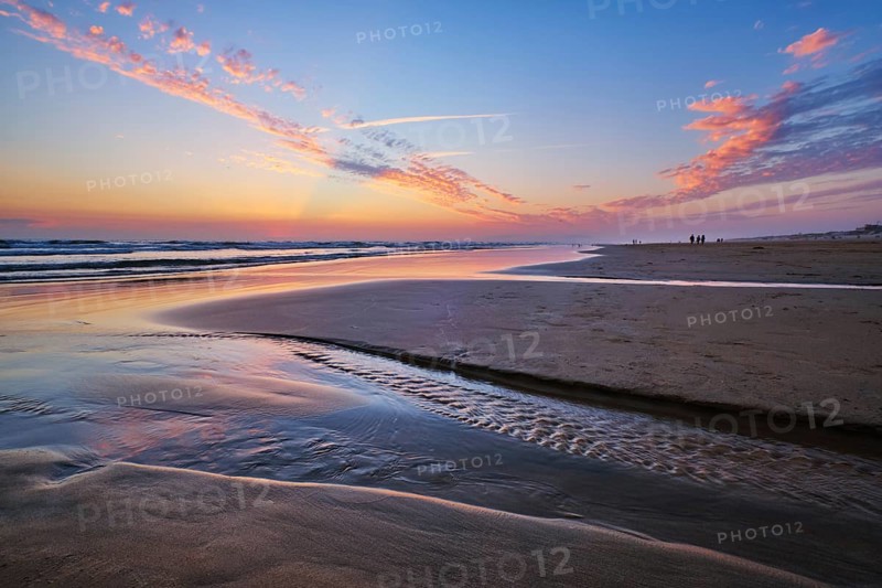 Atlantic ocean after sunset with surging waves at Fonte da Telha beach, Costa da Caparica, Portugal, Europe
