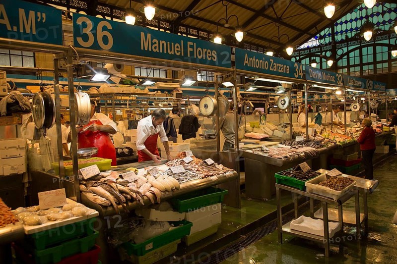 People shopping at fishmonger stalls inside historic covered market building, Jerez de la Frontera, Spain, Europe