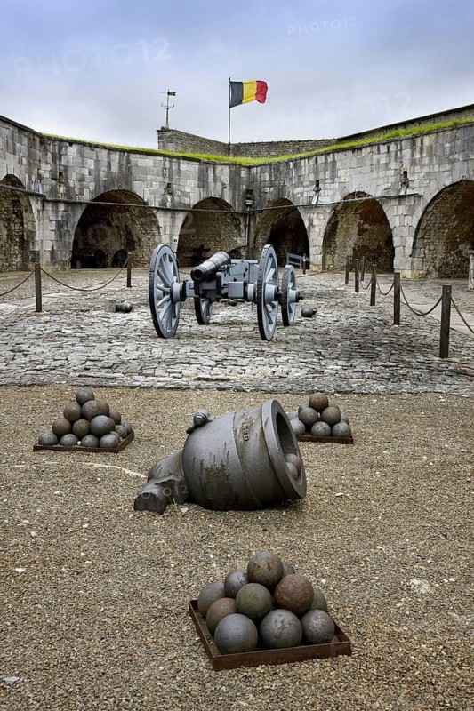 Cannon, mortar and cannonballs at inner court in the citadel at Dinant, Belgium, Europe
