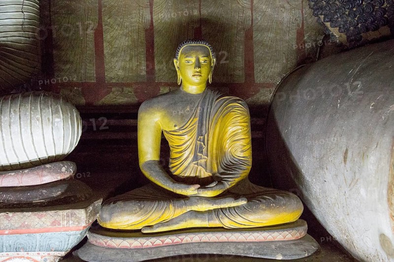Buddha figure inside Dambulla cave Buddhist temple complex, Sri Lanka, Asia