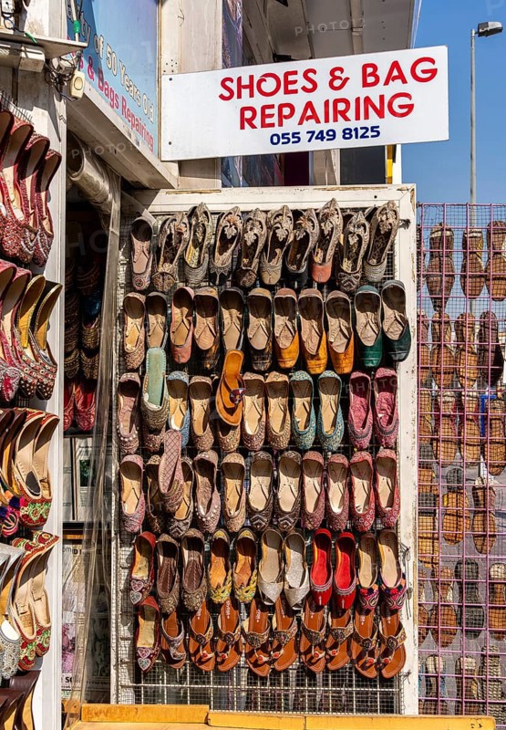 Shoe shops and craftsmen in the Al Fahidi neighbourhood, Dubai, United Arab Emirates, Asia