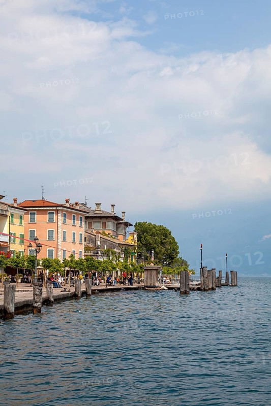 Waterfront promenade with restaurants in Gargnano, Lake Garda, Province of Brescia, Lombardy, Italy, Europe