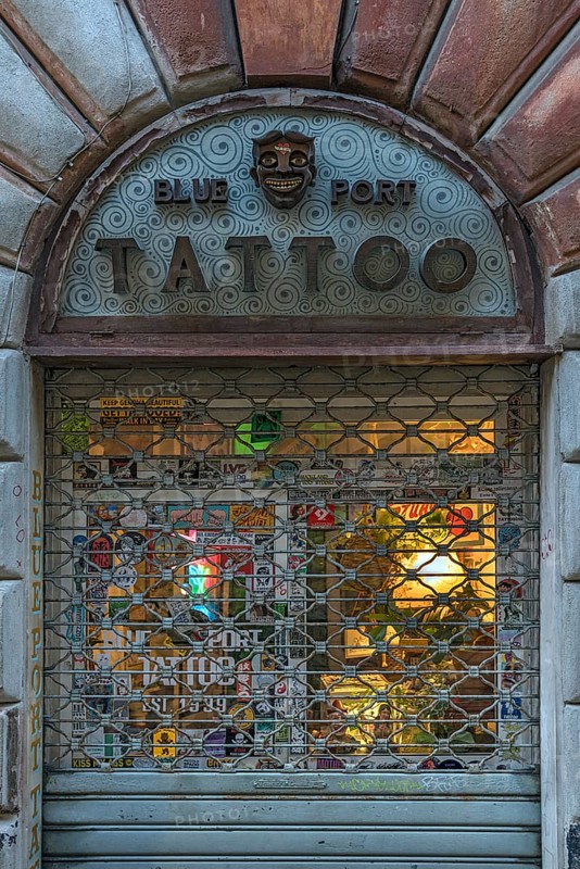 Barred tattoo parlour Blue Port Tattoo, after closing time, Via S. Donato, 63 r Genoa Italy