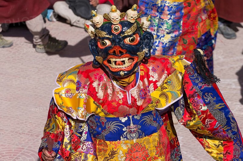 A monk performing cham, the sacred religious masked dance, during the Spituk Gustor winter festival in the Spituk Gompa, the Buddhist monastery near Leh, the capital of Ladakh. Many inhabitants of this Indian region, which is often called Little Tibet, follow the Tibetan Buddhism. District Leh, Union Territory of Ladakh, India, Asia